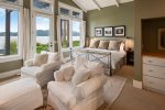 A romanic, main floor master suite with King bed and waterfront views.